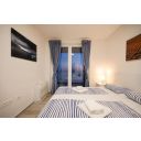 original_1769380885_villa-miri-privlaka-villa-miri-r1-bedroom-blankets-view-window-night.jpg